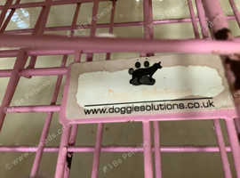 Pink dog crate.