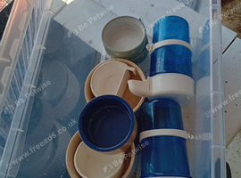 Mixed bundle of bird feed dishes and drinkers in container