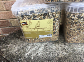 Three tubs of cockatiel seed
