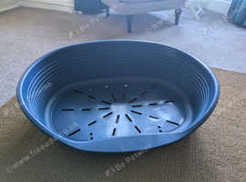 Large blue plastic blue dog bed