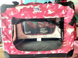 Pink dog carrier.