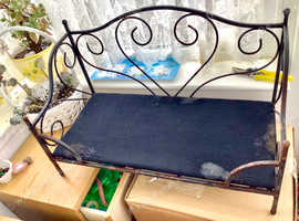 Ornate metal dog bed.