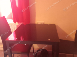 Black glass table with 2 chairs