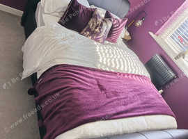 Faux leather upholstered double bed frame.