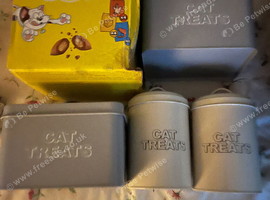 Box of dreamers and cat treat tins
