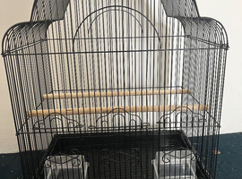 Bird cage with perches and bowls