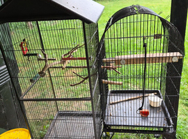 Two large upright cages