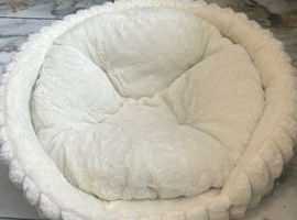 Soft donut shape bed.