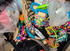 Bin liner full of bird toys