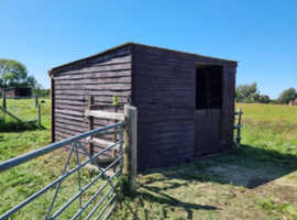 Small field with shelter and shed.