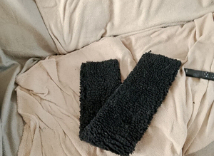 Black fluffy girth sleeve cover