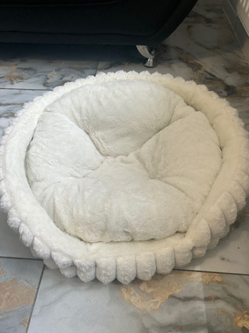 Soft donut shape bed.