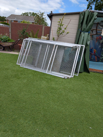 Large cage on wheels.