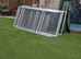 Large cage on wheels.